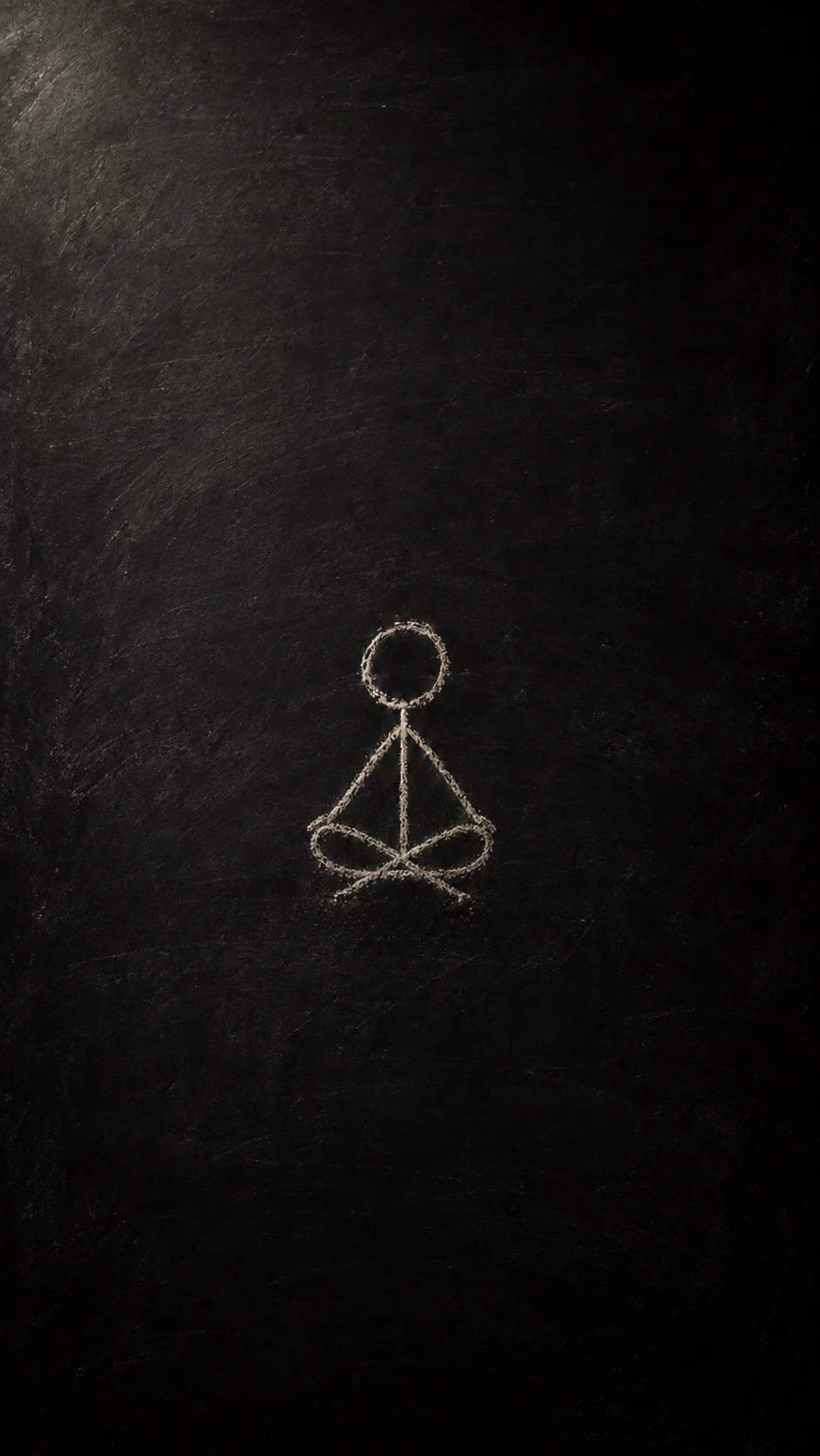 A small chalk child sits quietly with crossed legs.